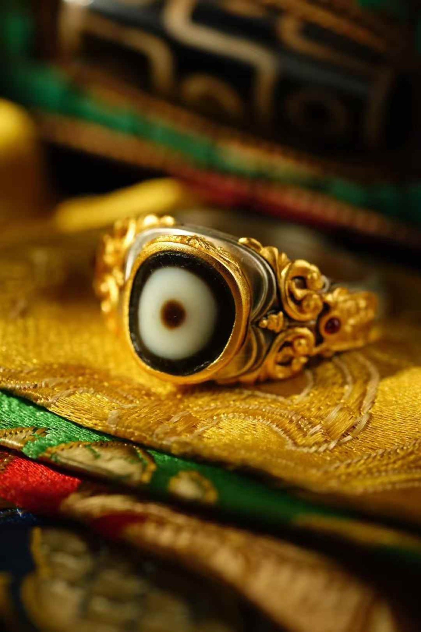 Zachiram Gilt Dzi Ring — Carved Gold Scrollwork, Adjustable — front view