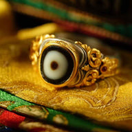 Zachiram Gilt Dzi Ring — Carved Gold Scrollwork, Adjustable — front view