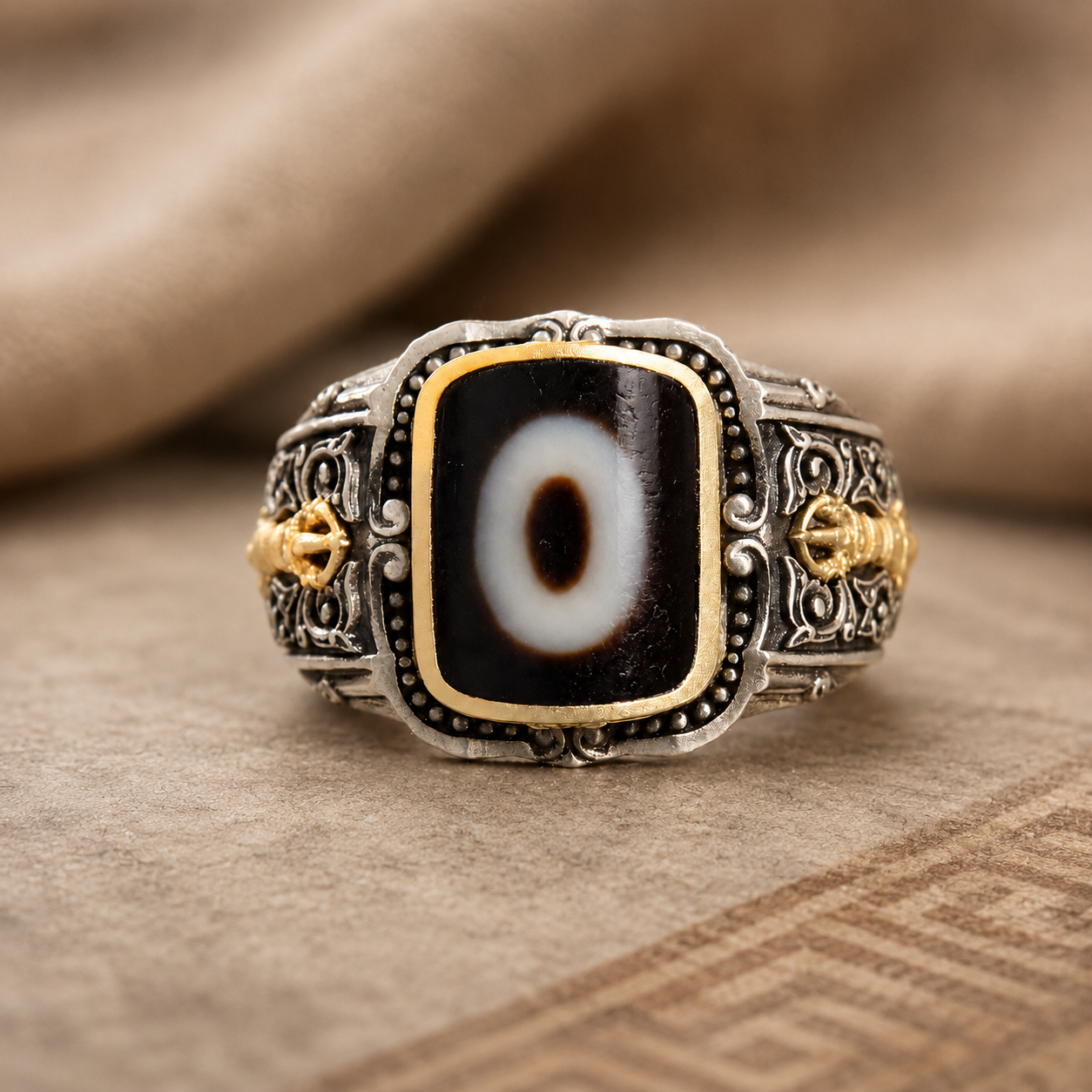 One-eyed dzi bead ring in S925 silver with gold vajra accents — front view
