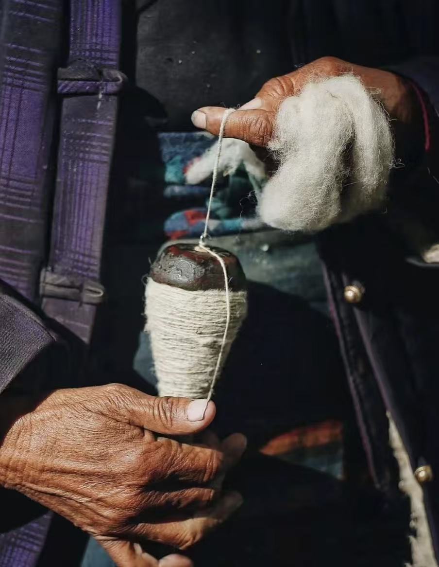 Tibetan artisan handcrafting jewelry — sacred craft tradition
